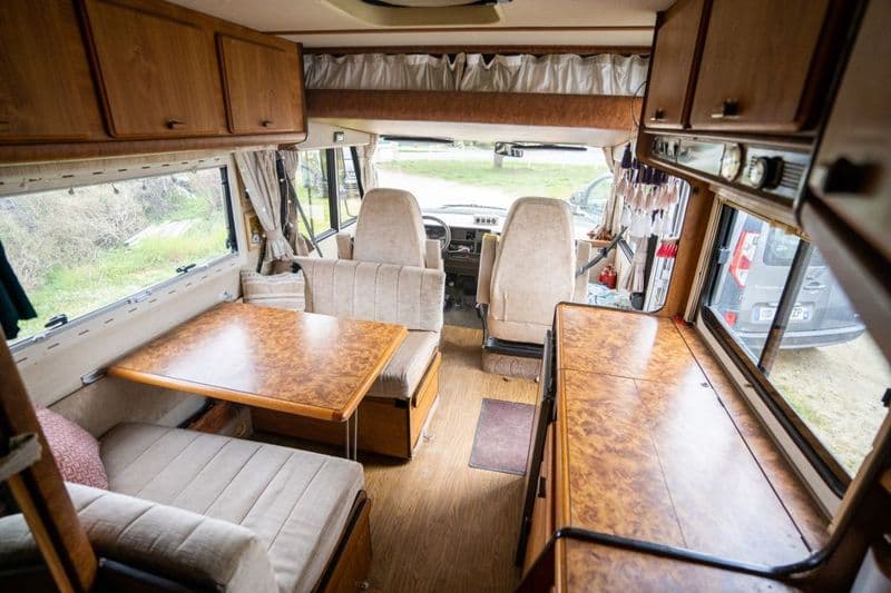 The wood-panelled interior of a camper
