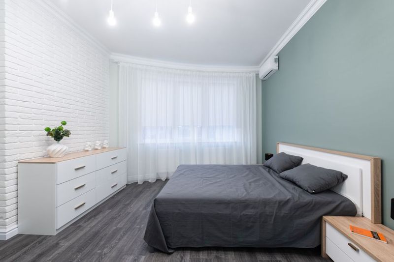 A calm bedroom with a made bed and bedside tables
