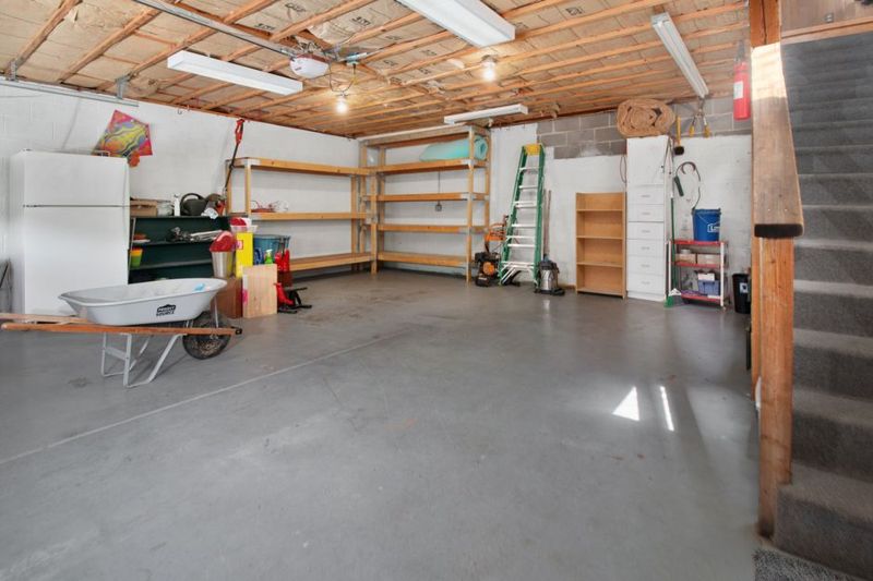 A garage with storage shelves and tools